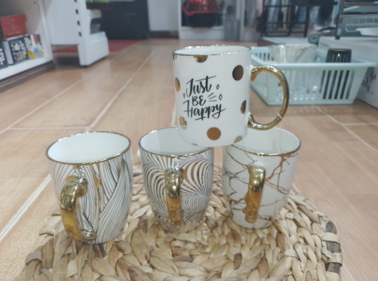 Cream and gold mugs