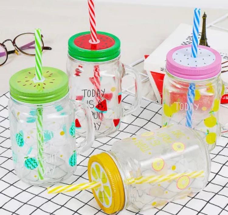 Glass mason jars with a straw